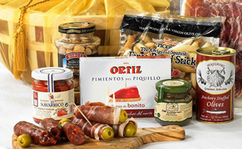array of gourmet food with gift basket
