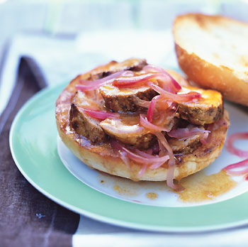 pork sandwich with pickled red onions