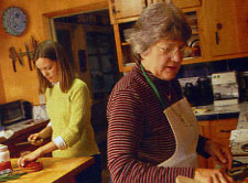 Amy Harris and Ruth Harris prepare food in the kitchen