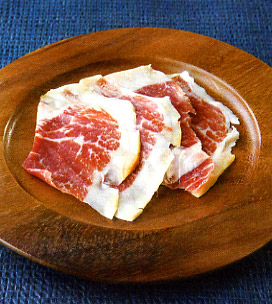 wooden plate of thinly sliced ibérico de bellota ham