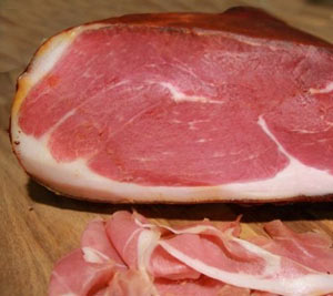 a cured serrano ham with slices