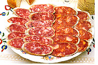 plate of sliced Iberico sausage