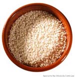 Bomba rice grains in a terra cotta cazuela